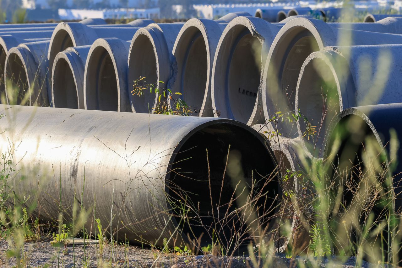 Stockpiled concrete pipe sections tagged and awaiting inspection records