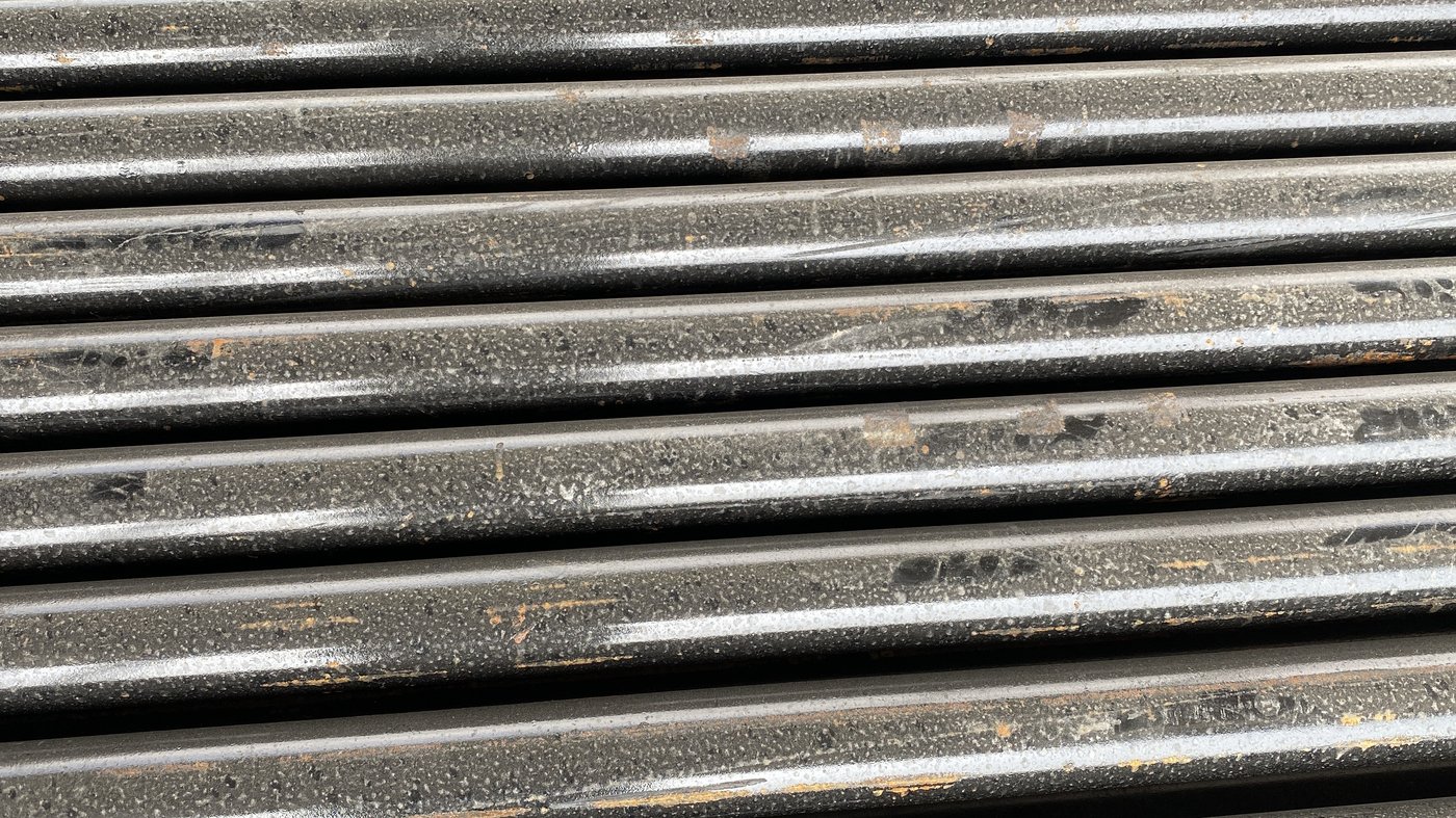 Close-up of coated OCTG steel casing surface texture