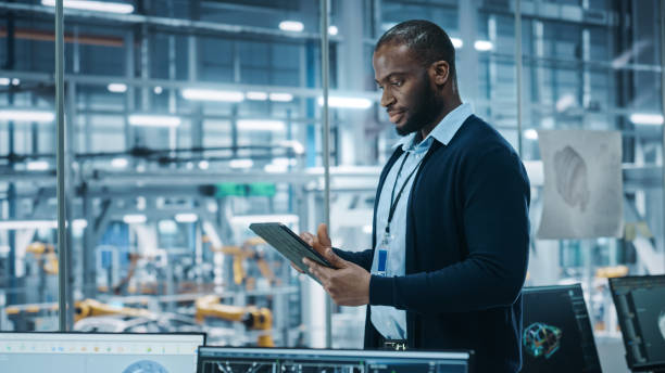 Engineer reviewing procurement and inventory data on a tablet